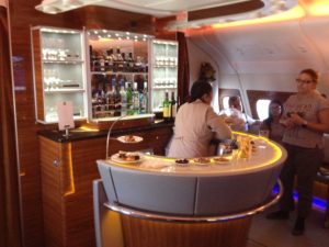 people sitting at a bar in an airplane