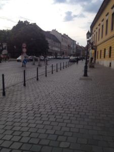a street with poles and buildings