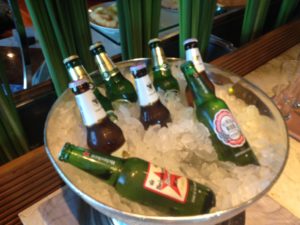 a bowl of beer bottles in ice