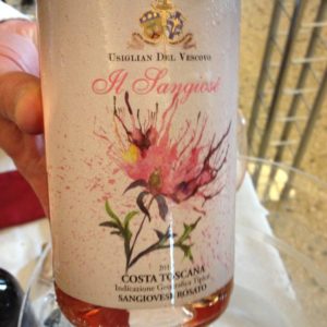 a bottle of wine with a pink flower