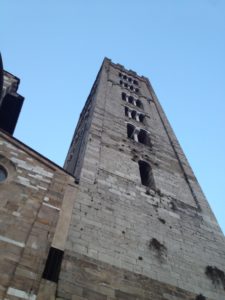 a tall stone building with a tower