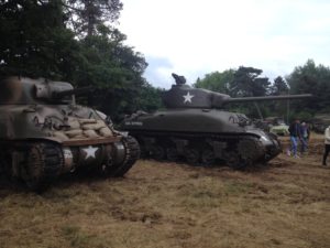 a group of military tanks in a field