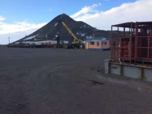 a construction site with a mountain in the background