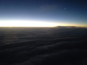 clouds and the sun above the clouds